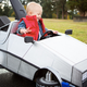 Illustration for article titled This Awesome Babys Marty McFly Costume and DeLorean Push Car Is Absolutely Adorable